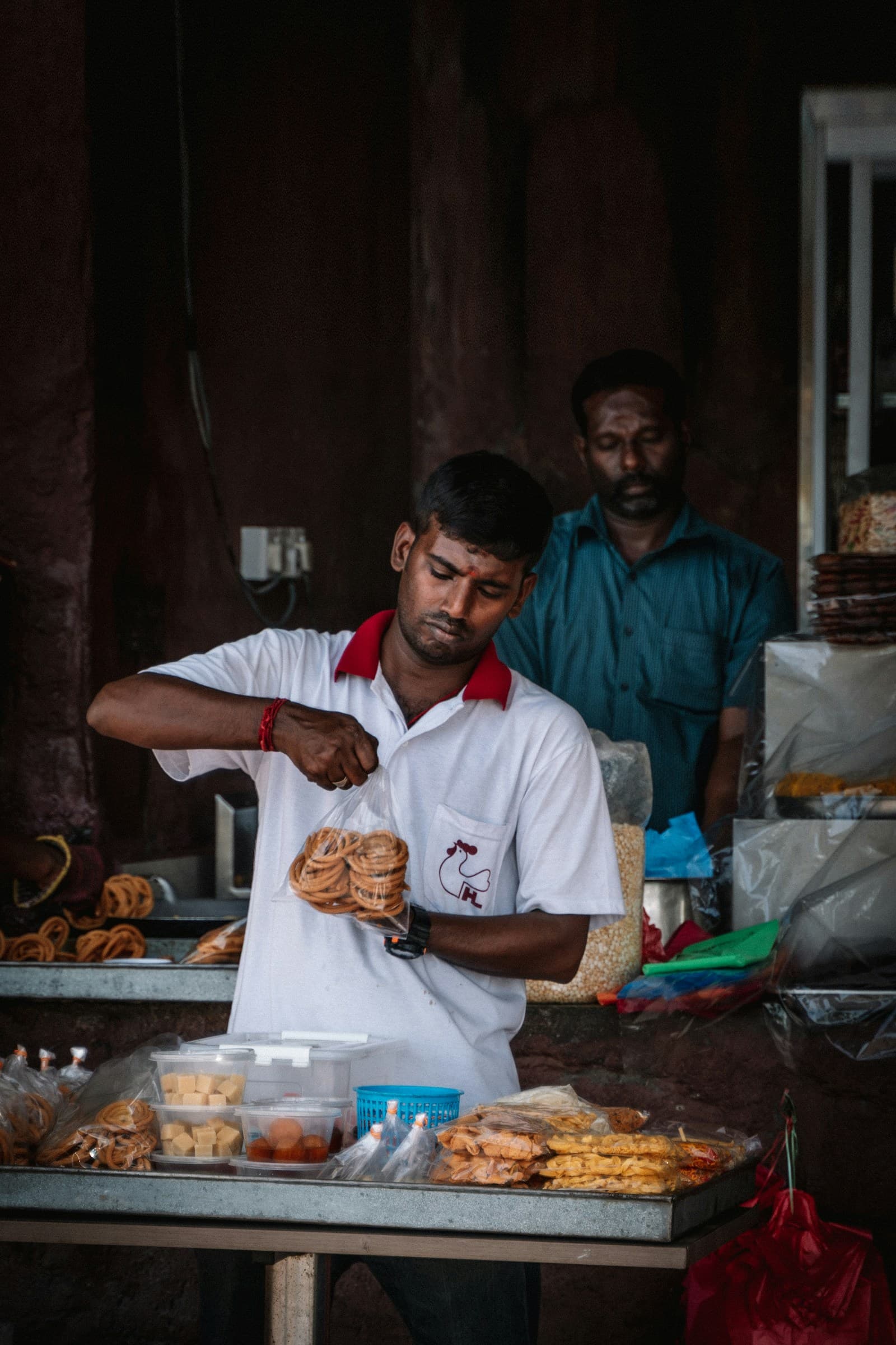 Hawker preparing food at his stall